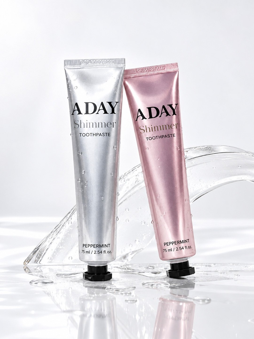 ADAY Shimmer Toothpaste in Silver Peppermint and Pink Peppermint side by side