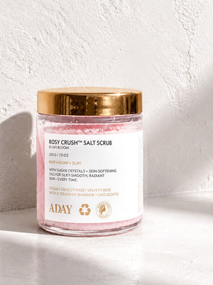 ADAY Rosy Crush Salt Scrub in Blush Bloom, a 200 g glass jar with a gold lid
