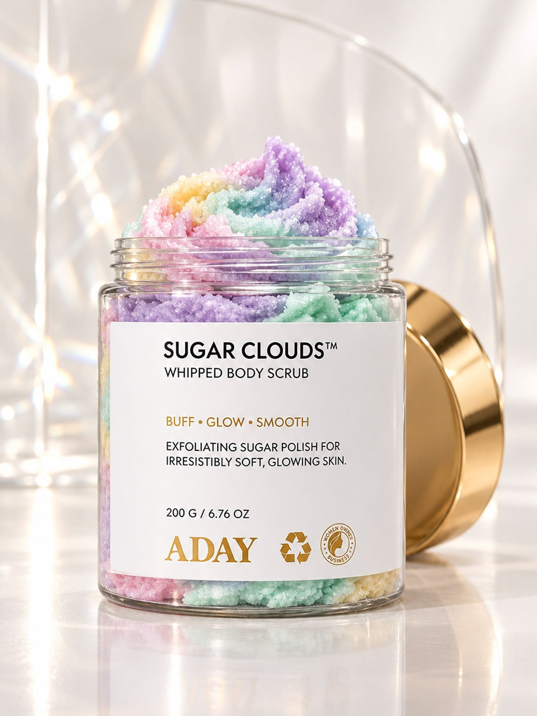 Scrub Trio: ADAY Sugar Clouds Whipped Body Scrub, open to show its pastel rainbow swirl