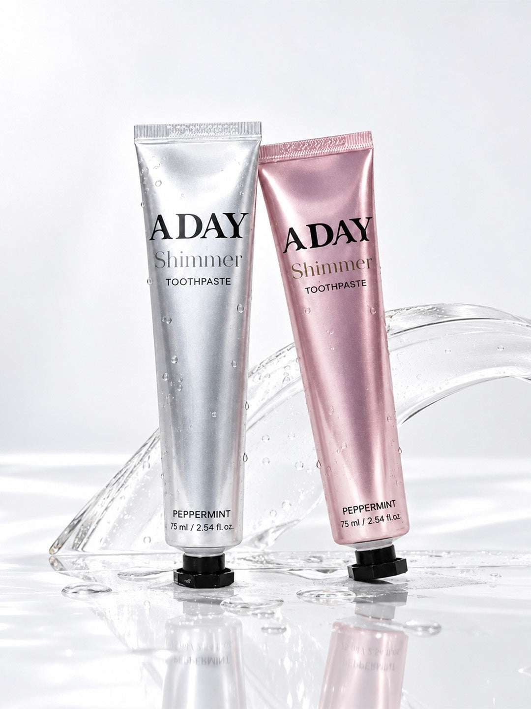 The ADAY Shimmer Smile Duo: Shimmer Toothpaste in Silver Peppermint and Pink Peppermint, two 75 ml tubes side by side