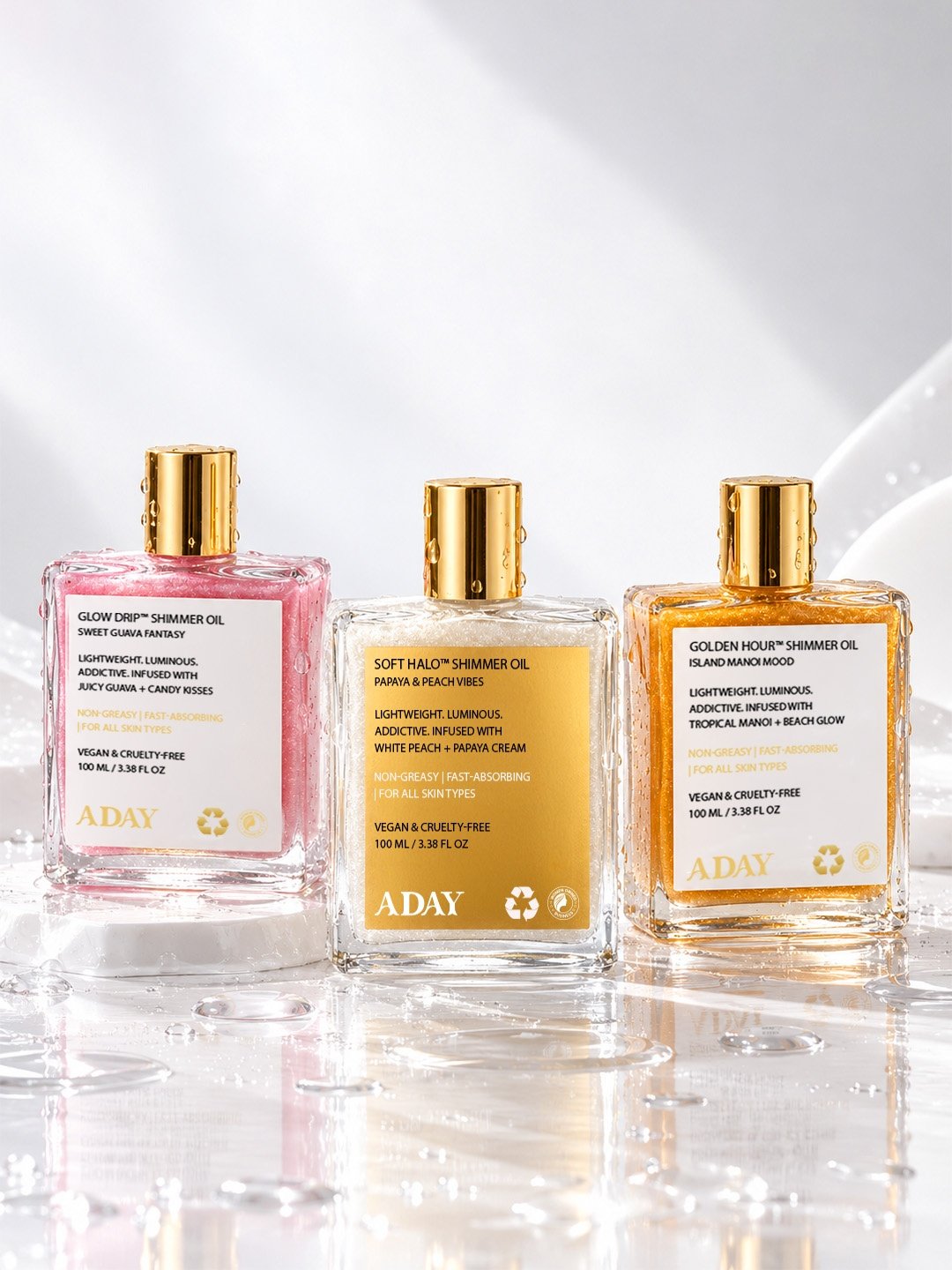 The three ADAY shimmer oils side by side: Sweet Guava Fantasy, Papaya & Peach Vibes and Island Manoi Mood