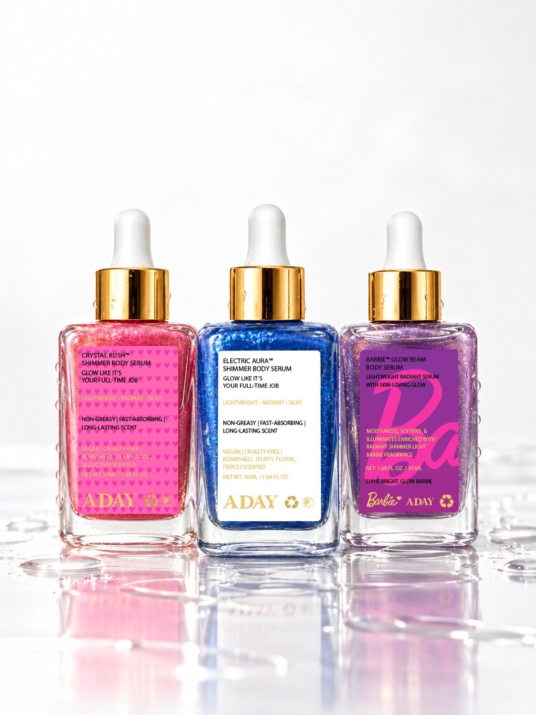 The three ADAY body serums side by side: Crystal Rush, Electric Aura and ADAY x Barbie Glow Beam
